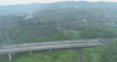 Aerial View of The Longest Active Train Bridge Cikubang and Cipularang Toll Road Stock Footage 131099594
