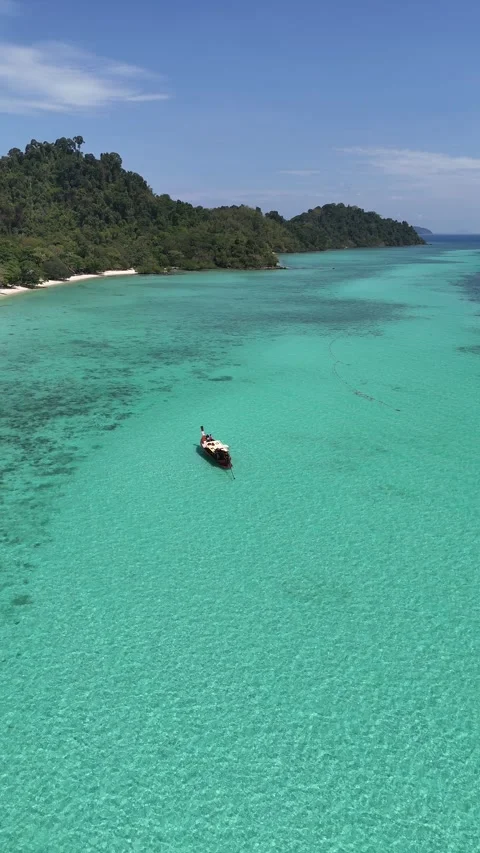 Aerial View of Longtail Boat Floating on Clear Turquoise Water in Ko Kradan, Stock Footage 336009056