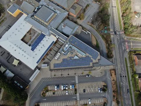 Aerial view looking directly down on a modern building and road Stock Photos