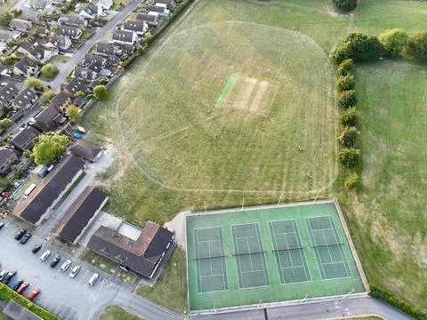 Aerial view looking directly down on tennis courts and a children's play area at 스톡 사진