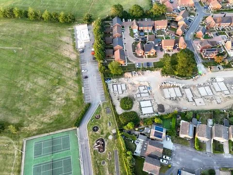 Aerial view looking directly down on tennis courts and a children's play area at Stock Photos