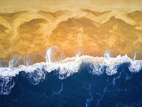 Aerial View looking down on a Beach. Deep Blue waves and beach Stock Photos
