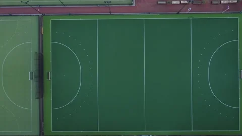Aerial view looking down at a bright green hockey field Stock Footage 142751373