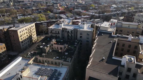 Aerial view looking down at Brooklyn rooftops Stock Footage 243876635