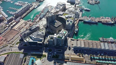 Aerial view looking down at the harbor and the luscious blue water around it Stock Footage 169889237