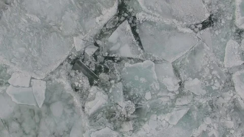 Aerial View looking down at Ice collecting on Lake Michigan Stock Footage 81879578