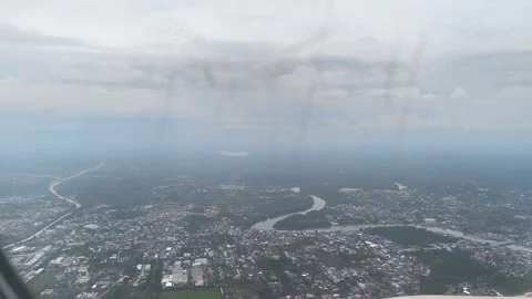 An aerial view looking down out of an airplane window Stock Footage 338421411