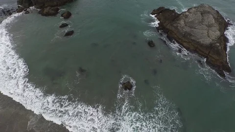 Aerial View Looking Down On Rock Formations on Ocean Shore 스톡 동영상 71162967