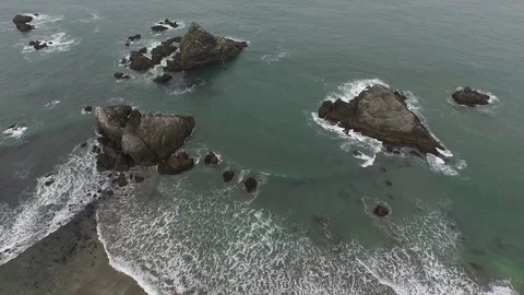Aerial View Looking Down On Rock Formations on Ocean Shore 스톡 동영상 71164558