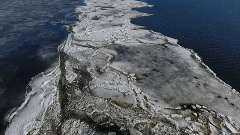 Aerial view looking down on volga river with frozen ice Stock Footage