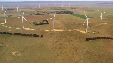 Aerial view looking downward to an array of large wind turbines Stock Footage 121095210