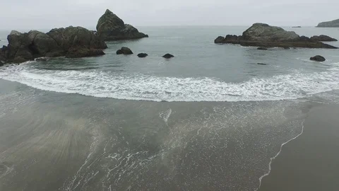 Aerial View Looking Of Rock Formations on Ocean Shore Stock Footage 71164813