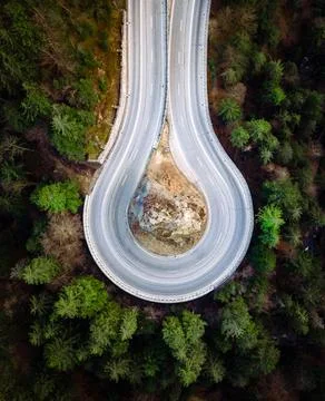 Aerial view on the loop road and forest at the summer time. Natural landscape Stock Photos