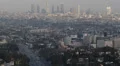 Aerial View of Los Angeles Skyline with Skyscrapers and Highway Car Traffic Jam HD Footage
