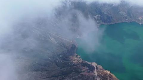 Aerial view of low clouds drifting near steep volcanic slopes, gradually 스톡 동영상 308404770