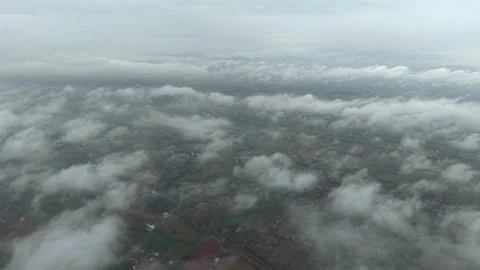 Aerial View of Low Clouds Floating Over Rural Landscape in Tamil Nadu India Stock Footage 330577178