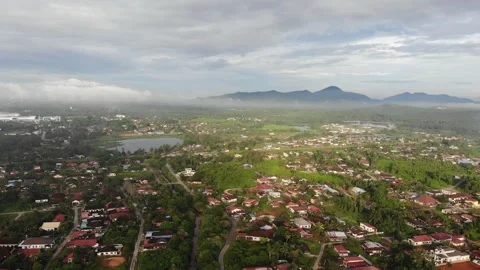 Aerial view of low clouds, lake and Gunung Semanggol, Perak Stock Footage 227857828