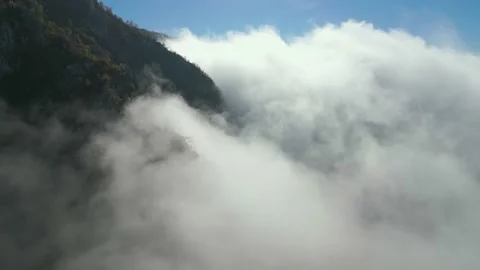 Aerial view, low clouds in the mountain valley Stock Footage 232273025