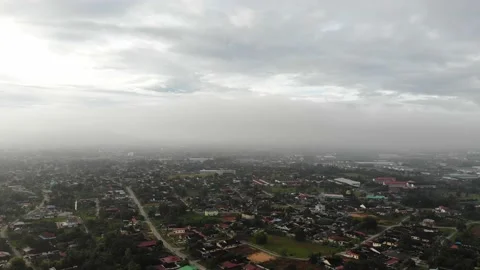 Aerial view of low clouds over a village in Kamunting, Taiping, Perak Stock Footage 227837228