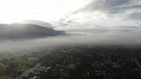 Aerial view of low clouds over a village in Kamunting, Taiping, Perak Stock Footage 227837236
