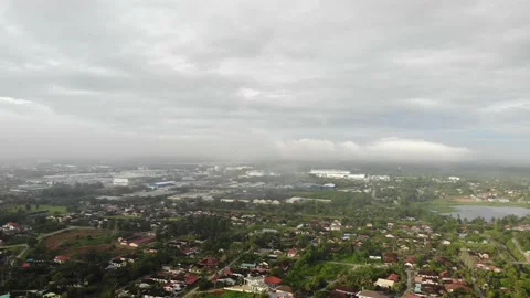 Aerial view of low clouds over a village in Kamunting, Taiping, Perak Stock Footage 227837270