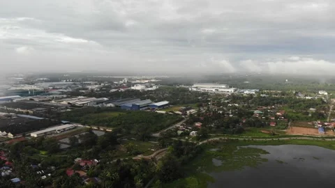 Aerial view of low clouds over factories and homes in Kamunting, Taiping Stock Footage 227858225