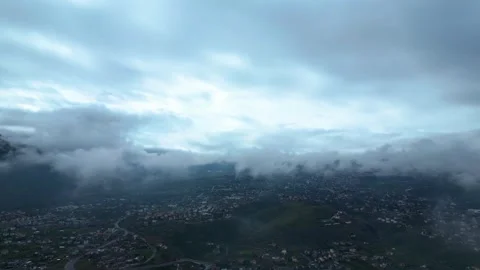 Aerial View of Low Clouds Over City Landscape Stock Footage 333375200