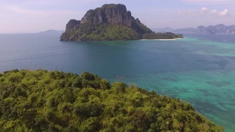 Aerial View Low Fly Over Small Island Reveal Tropical Emerald Sea  Stock Footage 83664744