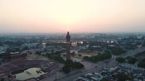 Aerial view of Lucknow's Clock Tower as the city wakes up, with sunrise casting Stock Footage 299251057