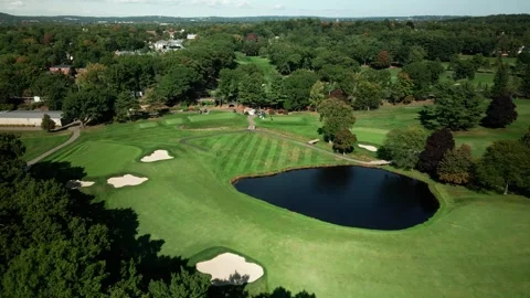 Aerial View of Lush Golf Course with Pond and Sand Bunkers 스톡 동영상 332686863