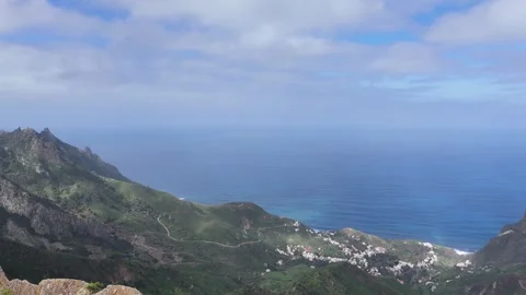 Aerial view of lush green mountain landscape showcasing gradual elevation Видео 335877662