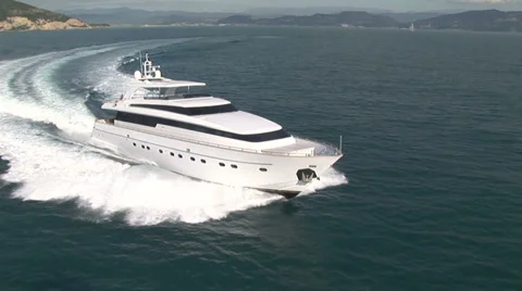 Aerial view of luxury yacht navigating Stock Footage