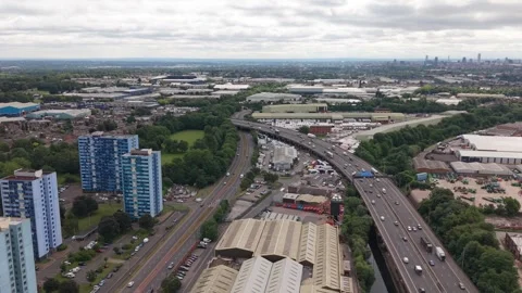 Aerial View of M5 Motorway Through Industrial and Residential Areas Stock-Footage 337347974