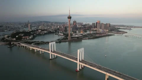 Aerial view of the Macau Tower and Sai Van Bridge city skyline Stock Footage 346687395