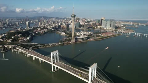 Aerial view of the Macau Tower and Sai Van Bridge city skyline Stock Footage 346688342