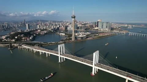 Aerial view of the Macau Tower and Sai Van Bridge city skyline Stock Footage 346688863