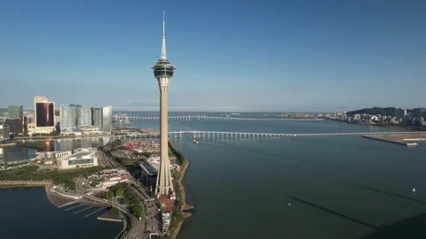 Aerial view of the Macau Tower landmark and city skyline Stock Footage 346688301