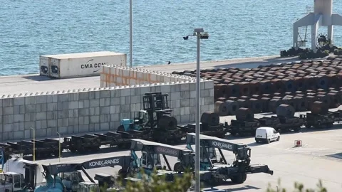 Aerial view of machines loading the train with metal coils in the port of Setuba Video stock 220003722