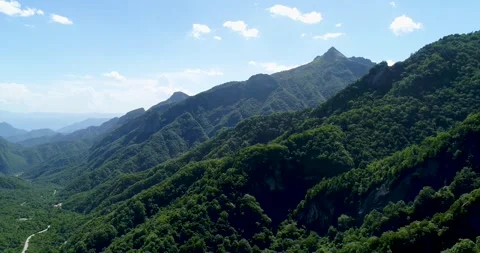 Aerial view of main peak steep ridge dense forest mountain scenery in Qinling Stock Footage 337925588
