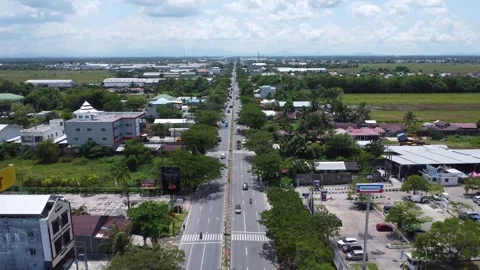 Aerial view of the main road in the warehouse area in Banjarmasin Stock Footage 322081280