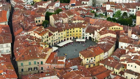 Aerial view of the main square, Piazza dell'Anfiteatro, in Lucca, Tuscany, Italy Stock Footage 253082457