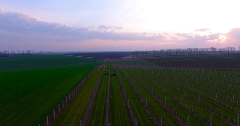 Aerial view of maintenance of the garden with two tractors. Video stock 88412361