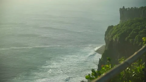 Aerial view of majestic limestone cliffs and turquoise ocean waves in Bali Stock Footage 334017973