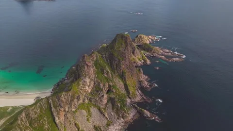Aerial View of Majestic Rocky Cliff Island and Turquoise Beach Stock Footage 337763243