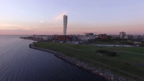 Aerial view of Malmo cityscape by the sea at dusk. Turning Torso building Stock Footage
