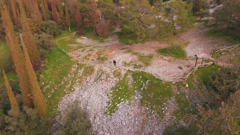 Aerial View of Man Alone Exploring Rocky Hill Surrounded by Nature 스톡 동영상 330986068
