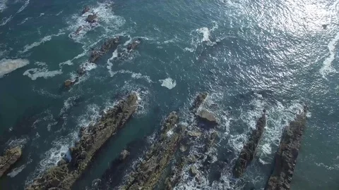 Aerial view of man with backpack on top of a cliff, Ireland Stock Footage 84271113