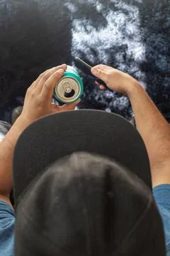 Aerial view of a man drinking a can of beer Stock Photos