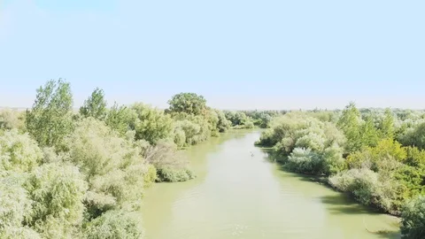 Aerial View of a Man Floating in a Canoe Stock Footage 96748371