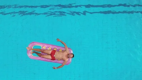Aerial View Of Man Floating On Inflatable Mattress, Relaxing. Stock-Footage 121251753